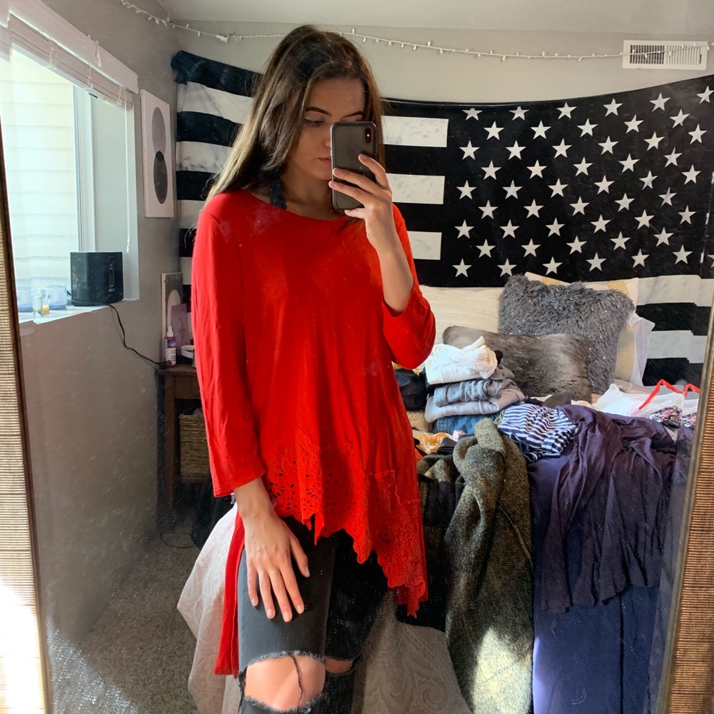 Beautiful red asymmetrical top with lace trim